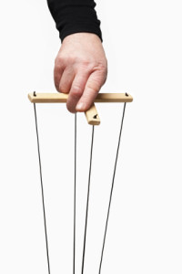 hand holding marionette control bar